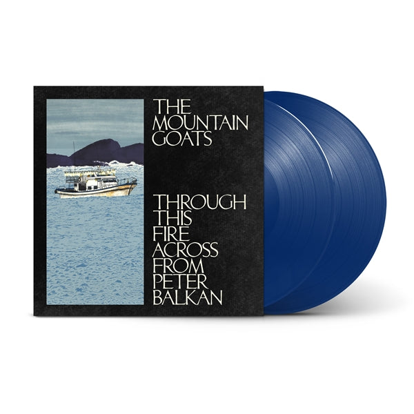 Mountain Goats - Through This Fire Across From Peter Balkan album with a black sleeve featuring the title text and a photo of a boat on water, next to a translucent blue record on a white background.