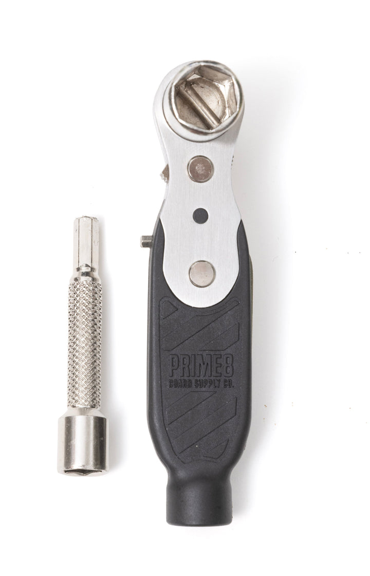 A black, silver, and gray PRIME8 skate tool with a triple ratchet system and a stainless steel and high impact composite handle.