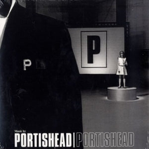 Portishead  Album cover with a figure on a pedestal and a large 'P' logo, featuring Portishead music.