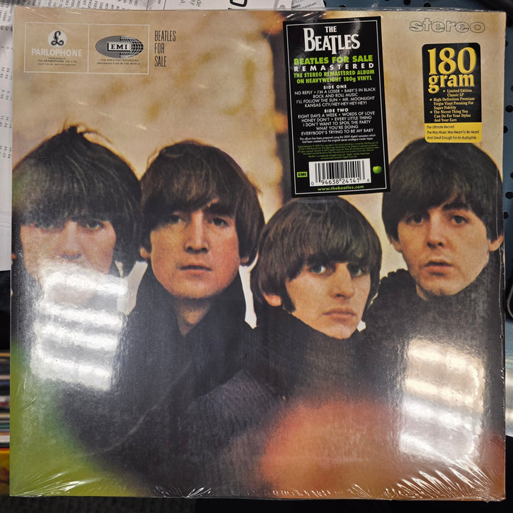 Vinyl record cover with a group of people on a dark background