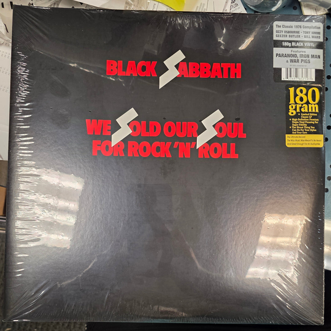 Vinyl record with 'Black Sabbath' text on a shelf