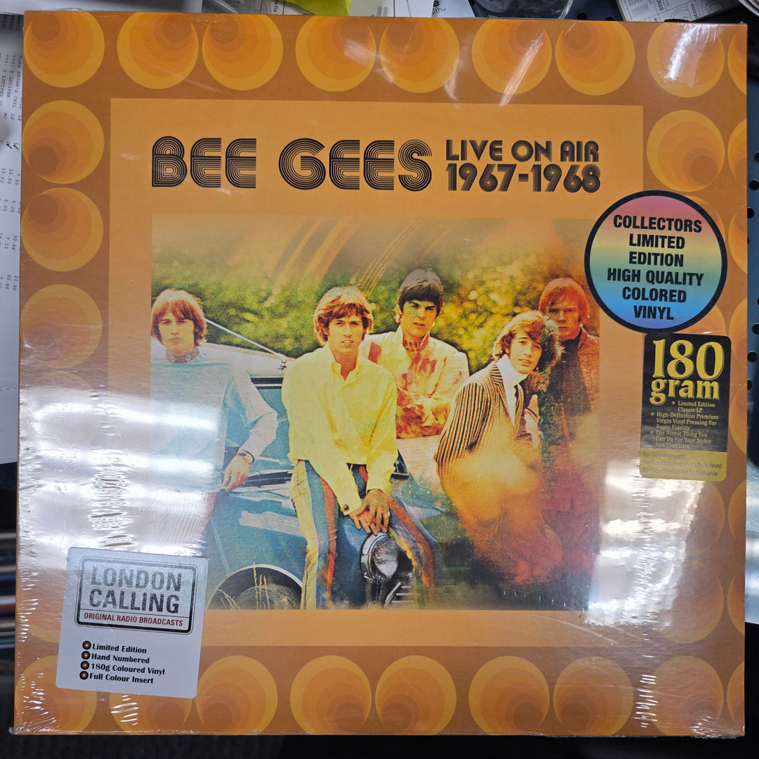 Vinyl record packaging with a yellow cover featuring an image of a couple and text.
