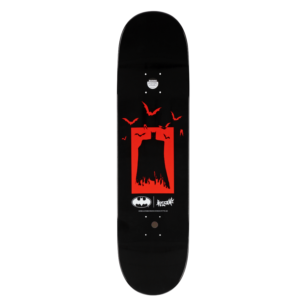 Black skateboard deck with red and white graphic design on a white background