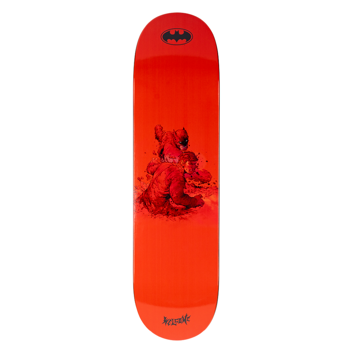 Red skateboard deck with a graphic design and Batman logo on a white background