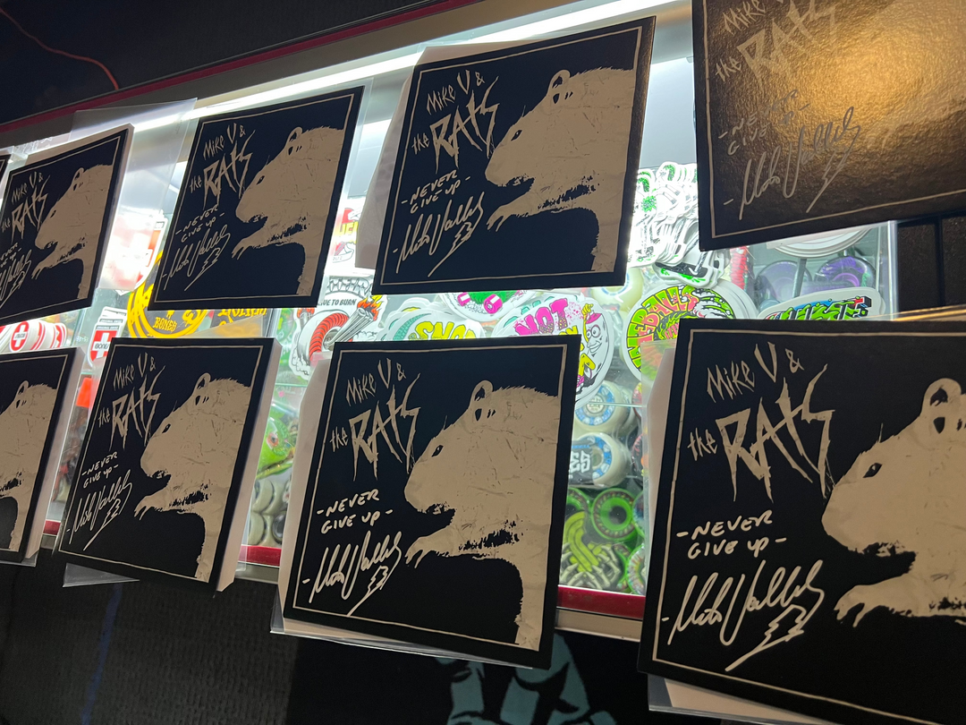 Several black Mike V & the Rats signed 7" records.  Autographed by Mike Vallely