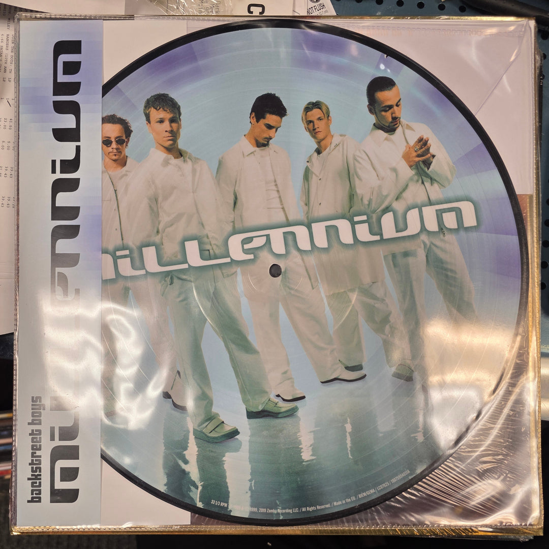 Vinyl record with a picture disc featuring a band on a reflective surface.