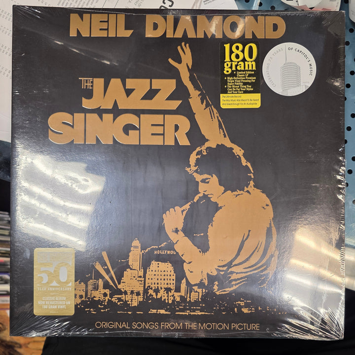 Vinyl record packaging for 'The Jazz Singer' by Neil Diamond on a pegboard background.