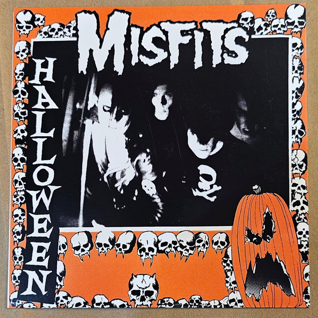 7" vinyl record Misfits Halloween with 'Misfits' and 'Halloween' text on an orange and black border.