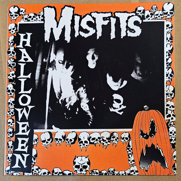 7" vinyl record Misfits Halloween with 'Misfits' and 'Halloween' text on an orange and black border.
