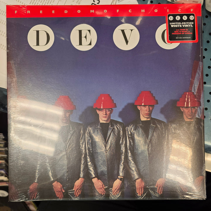 Vinyl record with a cover featuring a band and 'DEVO' branding.