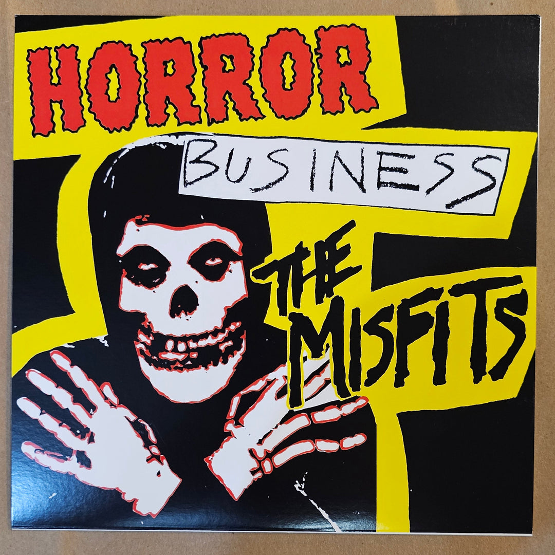 Album cover with text 'Horror Business' and 'The Misfits' on a yellow and black background.