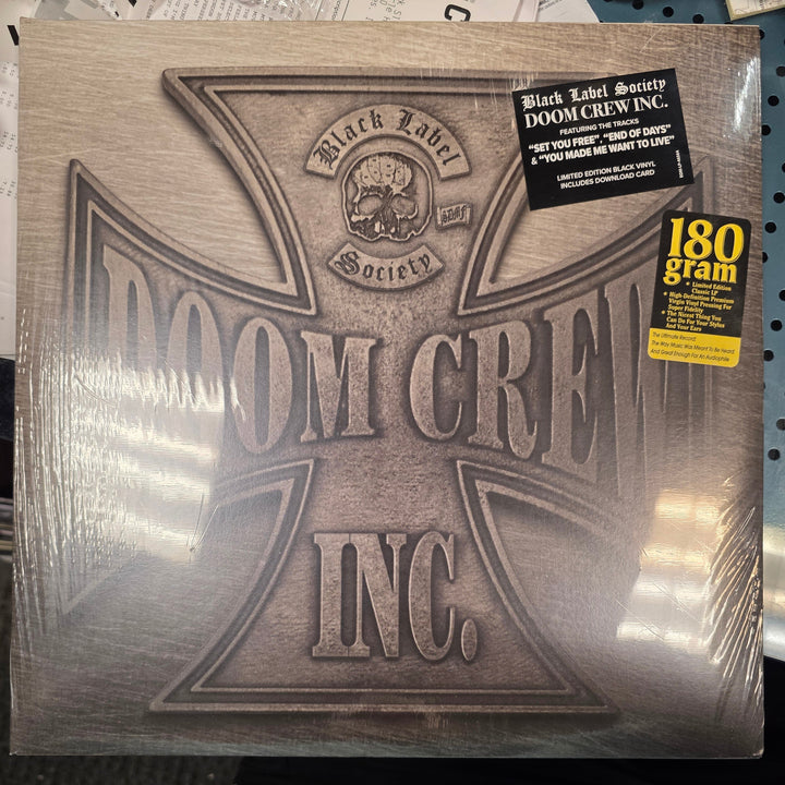 Metallic album cover with 'Moorcroft Inc.' branding on a newspaper background