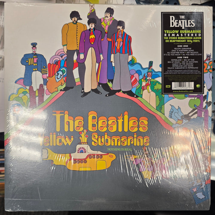 Vinyl record with 'The Beatles' cover art on a table