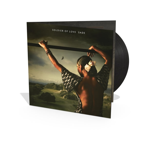 Sade - Soldier Of Love record with cover featuring a person holding an object against a scenic background