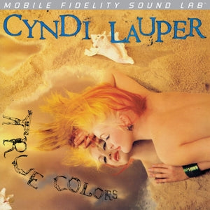 Album cover of 'All The Colors' by Cyndi Lauper with a person lying on sand.